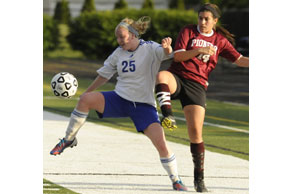 A LEG UP:  Waterford Our Lady of the Lakes’ Jessica Parry (No. 25) controls the ball away from Riverview Gabriel Richard’s Caitlin Perkins during Tuesday’s Division 4 regional semifinals. Courtesy Photo | Ken Swart, Swart Photography