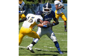 SHAKE AND BAKE: Waterford Our Lady of the Lakes'ZackZednik carries the ball upfield in Saturday's 19-18 win over Melvindale ABT. Photo | Larry McKee, www.lmckeephotography.com, lmckeephotography@comcast.net
