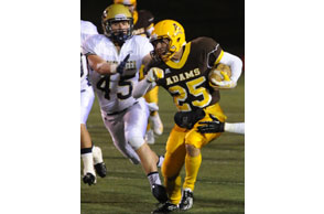 ELUSIVE: Rochester Adams' Jordan Shive outraces Rochester Stoney Creek's Joe Platz during Friday's Division 1 pre-district contest. Photo | Ken Swart, Swart Photography.