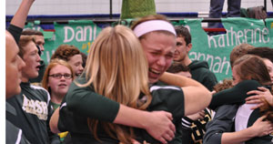 TEARS OF JOY: Pontiac Notre Dame Prep'sDani McCormick hugs teammates and coaches moments after the Fighting Irish were crowned state champions. Photo | Dan Stickradt