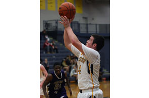 FIRE AWAY: Clarkston'sNick Owens fires up this three-pointer during the Wolves'win Monday over Pontiac. Photo | Larry McKee, www.lmkeephotography.com