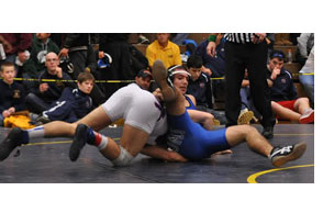 WRESTLING: Catholic Central joins elite company by winning fifth straight Oakland County title