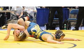 ALL TANGLED UP: Oxford's Noah Kinnie tires to escape Grandville;s Jake Brower during a 152-pound match at Friday's Division 1 state quarterfinals at Kellogg Arena. Courtesy Photo | Scott Keyes, SportsScene